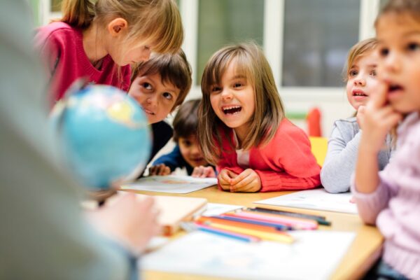 Teacher teaching her children