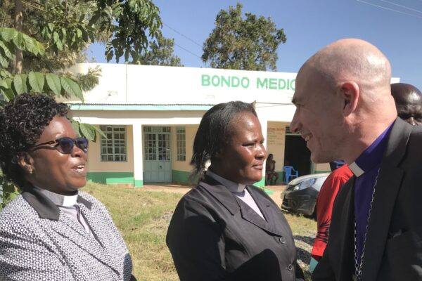 Bishop Pete in Bondo shaking hands