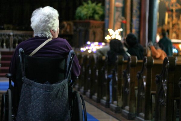 Lady in wheelchair in church
