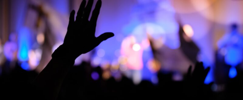 Hands raising concert, hands raising for religion background