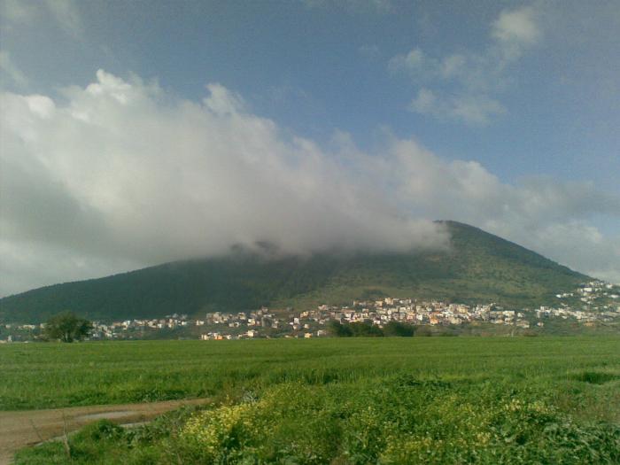 Clouds covering the top of Mount Tabor in Israel
