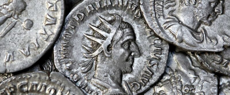 Multiple Roman silver coins showing different Roman emperors