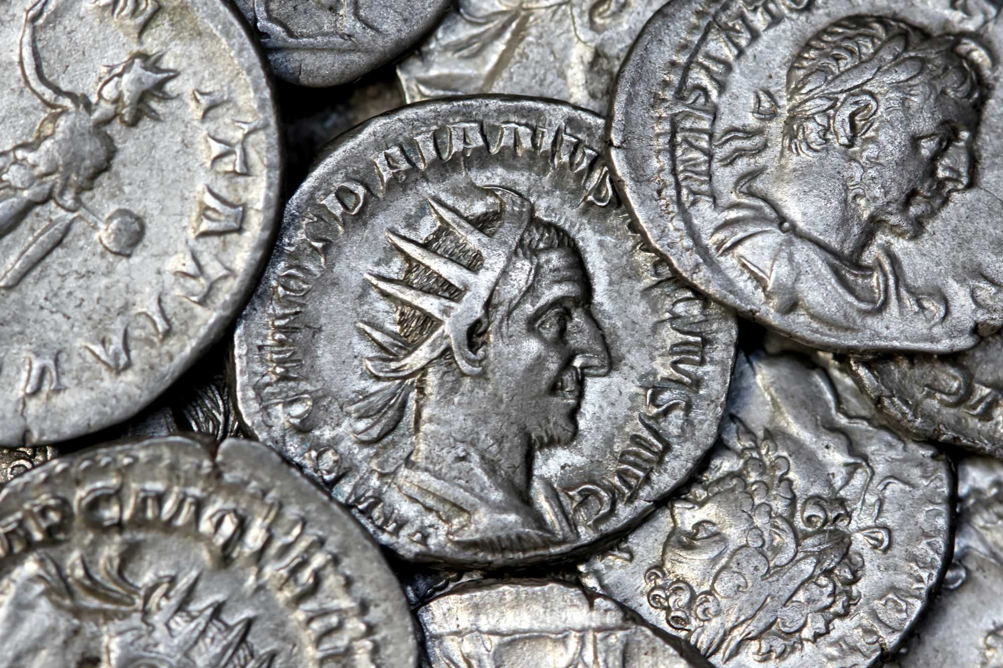 Multiple Roman silver coins showing different Roman emperors
