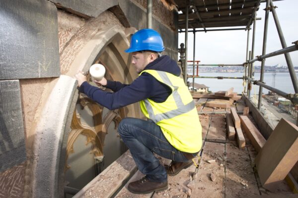 stonemason working on a church