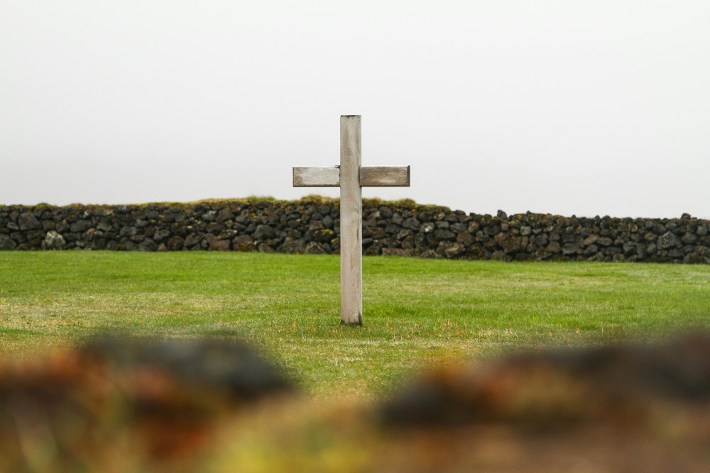 Wooden cross in a field