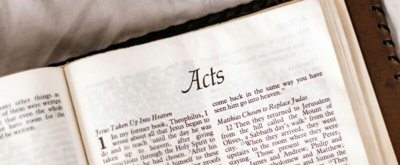 Bible open to the first page of Acts