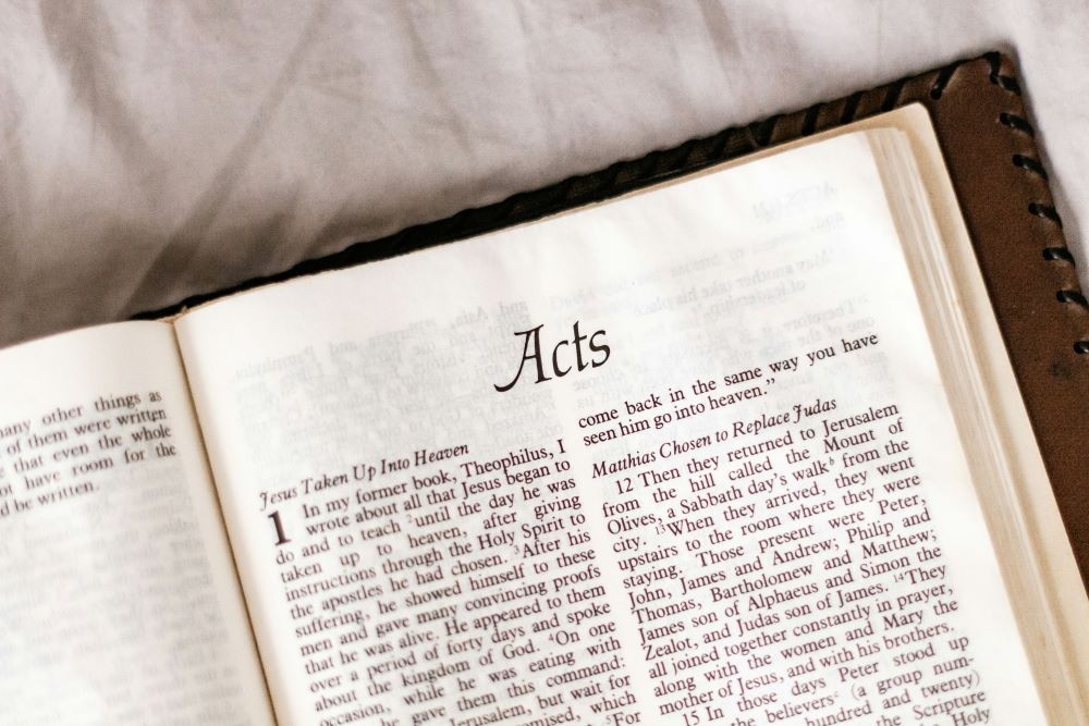 Bible open to the first page of Acts